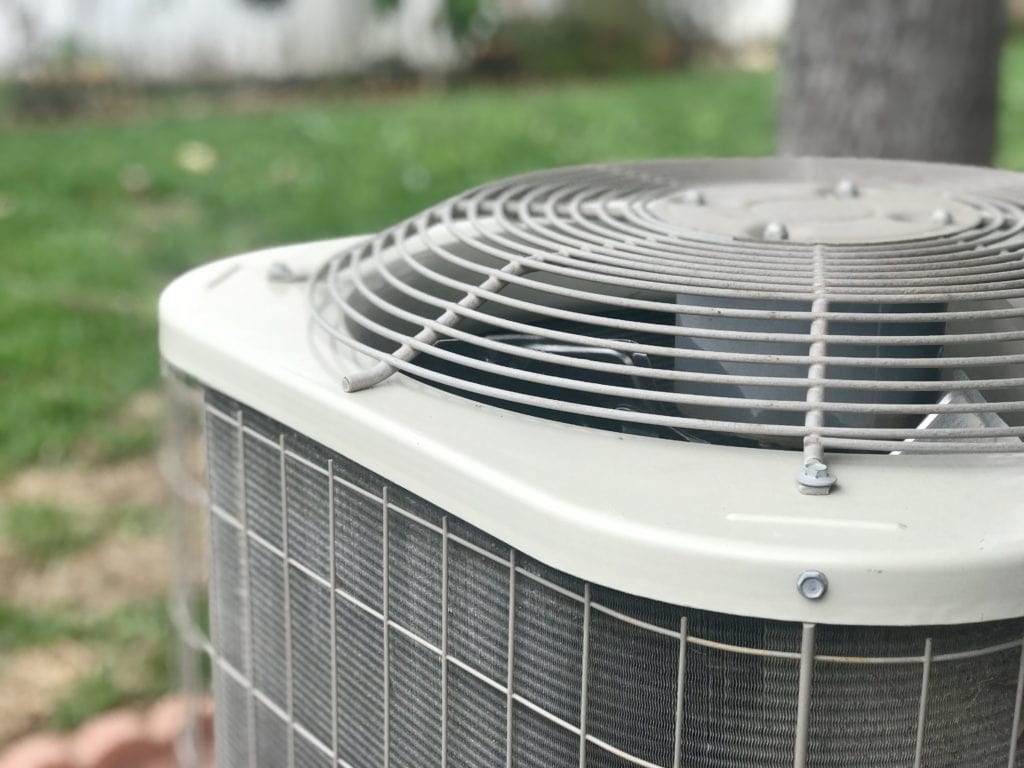 Close up of a residential air conditioning unit.