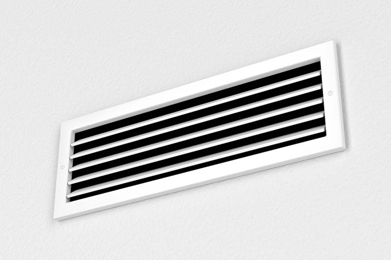 photo of an air vent without much color to the image.