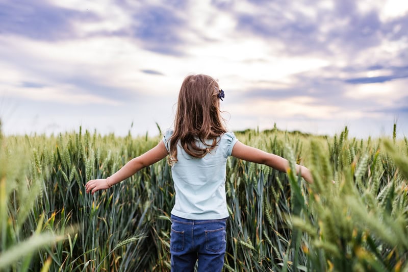 5 Electrical Tips to Save Money. Photo of a young female child in a field during the daylight.