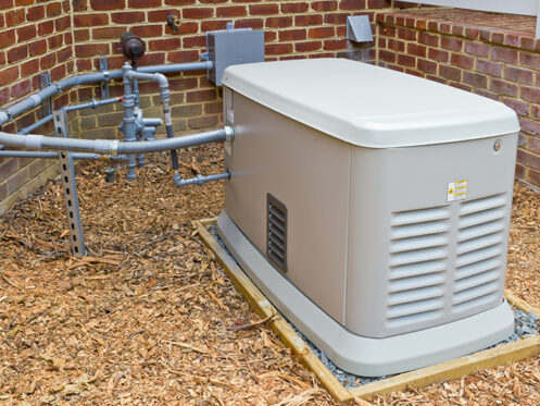 Power Outage? A Standby Generator Will Help You Weather the Storm. A standby generator outside of a building.